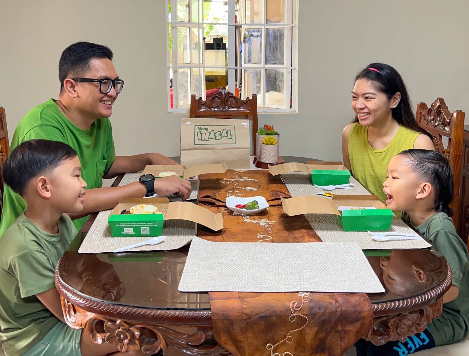 Mayen Comia with her husband and sons
